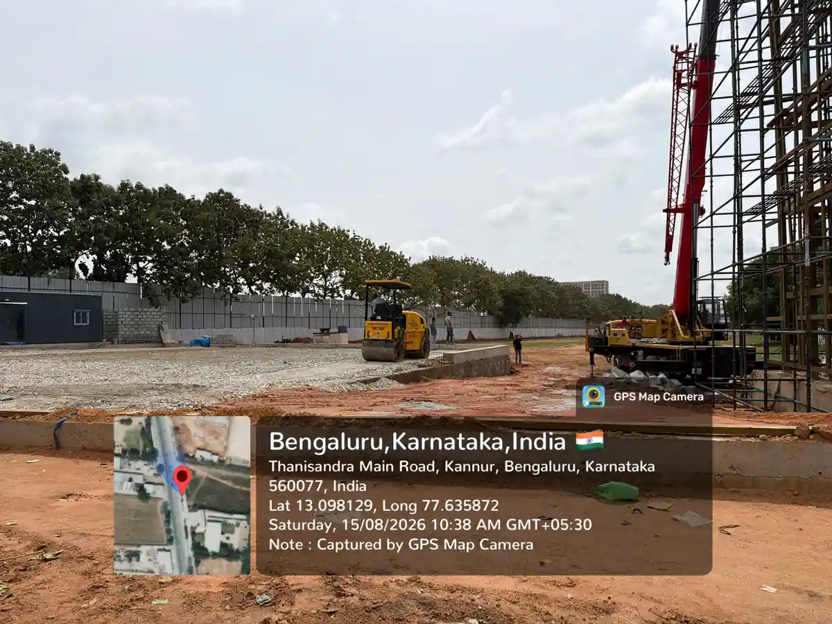 Featured Image of Prestige Avon Construction Update August 2026 - levelled plot seen from the eastern boundary with mobile crane on site, GPS-stamped Thanisandra Main Road