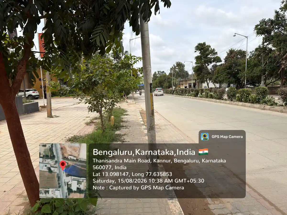 Featured Image of Thanisandra Main Road at Prestige Avon - six-lane concrete carriageway with planted median, GPS-stamped